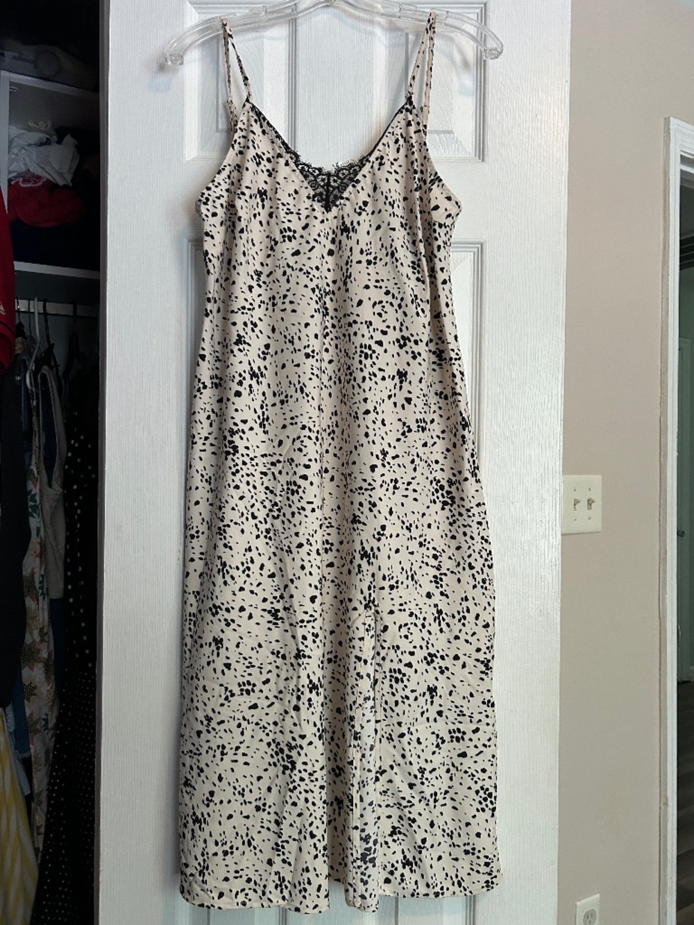 A new day cream and black midi dress
